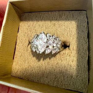 Multi-stone ring. Marquee and round clear stones. Size 8. Silver color.